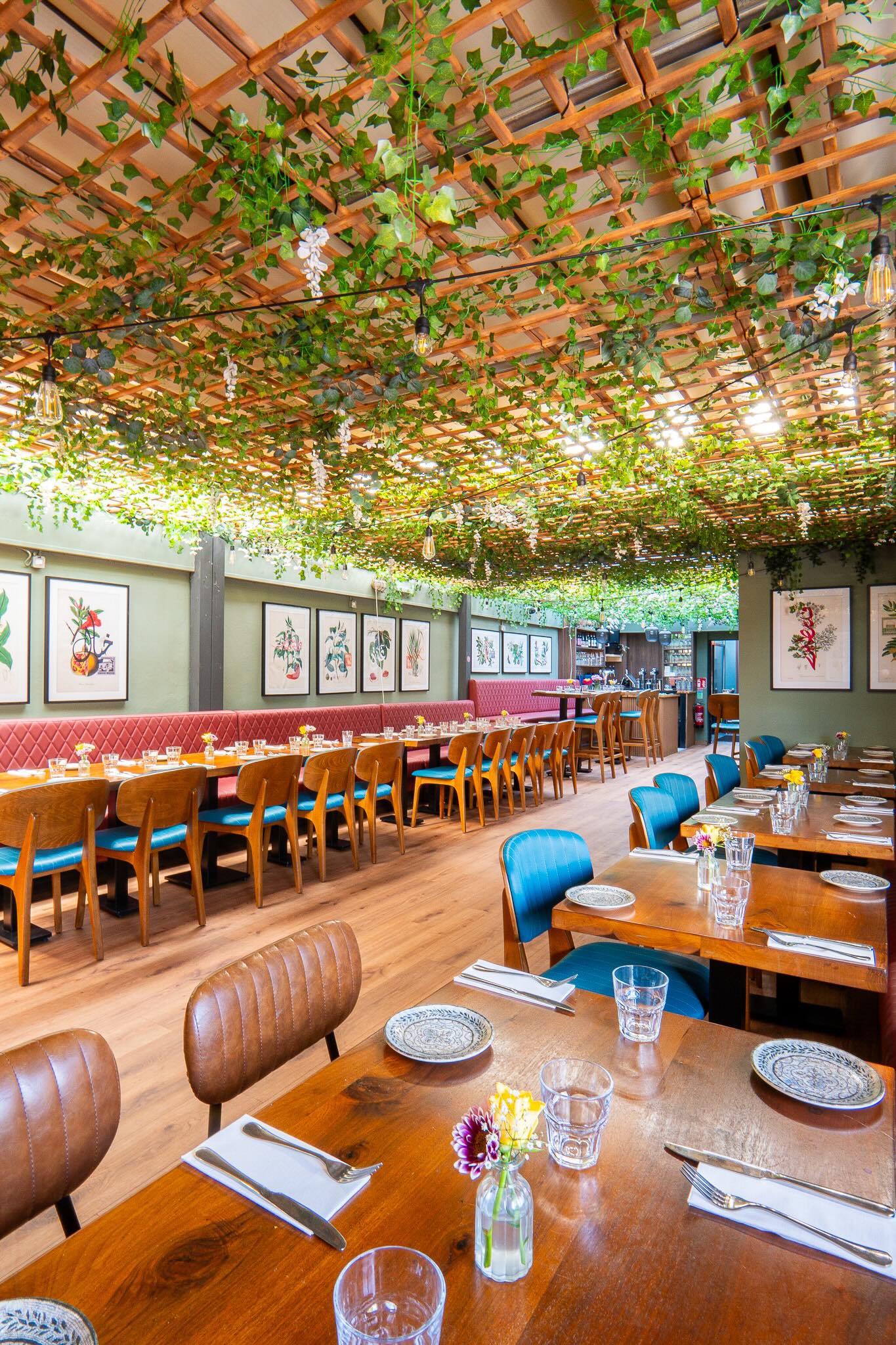 Restaurant interior photography of a Dublin dining room with a planted ceiling and banquette seating